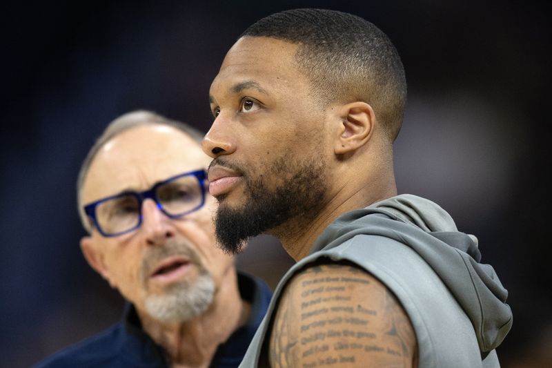 Mar 18, 2025; San Francisco, California, USA; Milwaukee Bucks guard Damian Lillard (right) chats up Golden State Warriors assistant coach Ron Adams before a game at Chase Center. Mandatory Credit: D. Ross Cameron-Imagn Images/File Photo