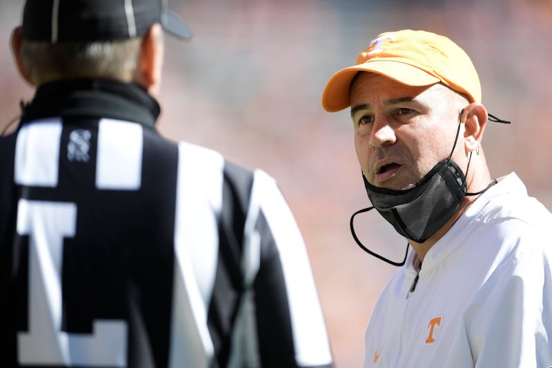 FILE PHOTO: Oct 17, 2020; Knoxville, TN, USA; Tennessee head coach Jeremy Pruitt argues a call with an official during the second half of a game between Tennessee and Kentucky at Neyland Stadium in Knoxville, Tenn. on Saturday, Oct. 17, 2020. Mandatory Credit: Calvin Mattheis-USA TODAY/File Photo