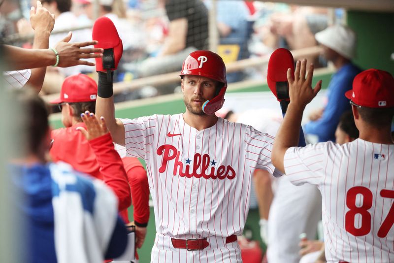 FILE PHOTO: Mar 24, 2025; Clearwater, Florida, USA; Philadelphia Phillies shortstop Trea Turner (7) is congratulated after he scored a run during the first inning against the Tampa Bay Rays  at BayCare Ballpark. Mandatory Credit: Kim Klement Neitzel-Imagn Images/File Photo