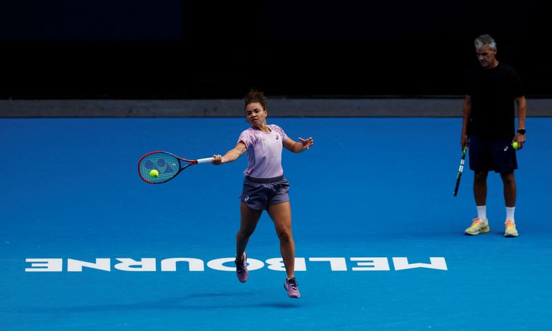 FILE PHOTO: Tennis - Australian Open - Practice - Melbourne Park, Melbourne, Australia - January 10, 2025 Italy's Jasmine Paolini during a practice session ahead of the Australian Open as coach Renzo Furlan looks on REUTERS/Francis Mascarenhas/File Photo