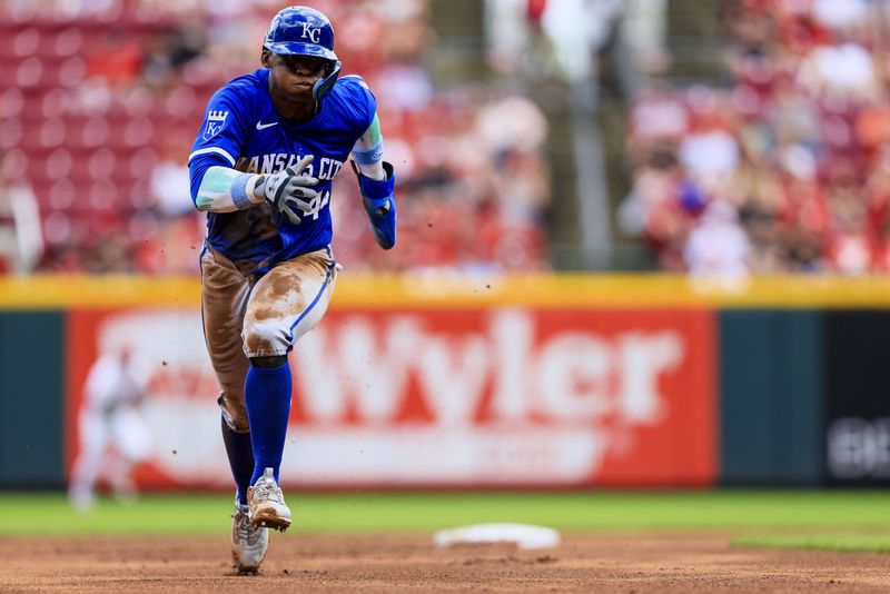 FILE PHOTO: Aug 18, 2024; Cincinnati, Ohio, USA; Kansas City Royals outfielder Dairon Blanco (44) scores on a RBI single hit by designated hitter Vinnie Pasquantino (not pictured) in the third inning against the Cincinnati Reds at Great American Ball Park. Mandatory Credit: Katie Stratman-USA TODAY Sports/File Photo