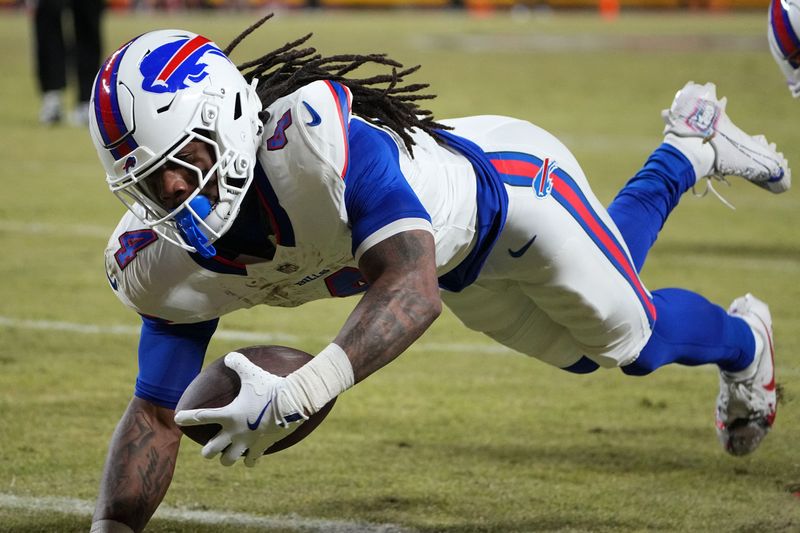 FILE PHOTO: Jan 26, 2025; Kansas City, MO, USA; Buffalo Bills running back James Cook (4) dives for a touchdown against the Kansas City Chiefs in the AFC Championship game at GEHA Field at Arrowhead Stadium. Mandatory Credit: Denny Medley-Imagn Images/File Photo