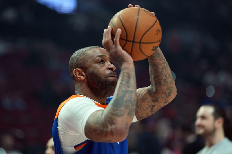FILE PHOTO: Mar 12, 2025; Portland, Oregon, USA;  New York Knicks power forward P.J. Tucker (17) warms up before the game against the Portland Trail Blazers at Moda Center. Mandatory Credit: Soobum Im-Imagn Images/File Photo