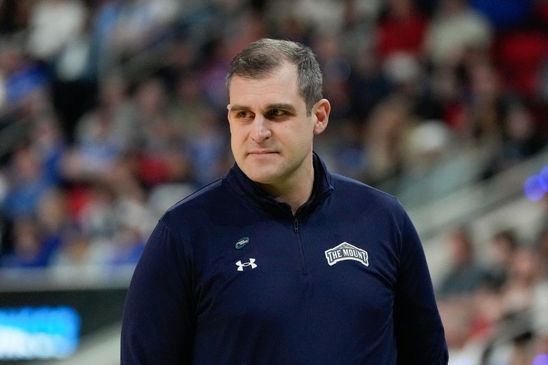 FILE PHOTO: Mar 21, 2025; Raleigh, NC, USA; Mount St. Mary's Mountaineers head coach Donny Lind looks on during the first half against the Duke Blue Devils in the first round of the NCAA Tournament at Lenovo Center. Mandatory Credit: Bob Donnan-Imagn Images/File Photo