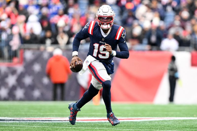 FILE PHOTO: Jan 5, 2025; Foxborough, Massachusetts, USA; New England Patriots quarterback Joe Milton III (19) runs against the Buffalo Bills during the first half at Gillette Stadium. Mandatory Credit: Brian Fluharty-Imagn Images/File Photo