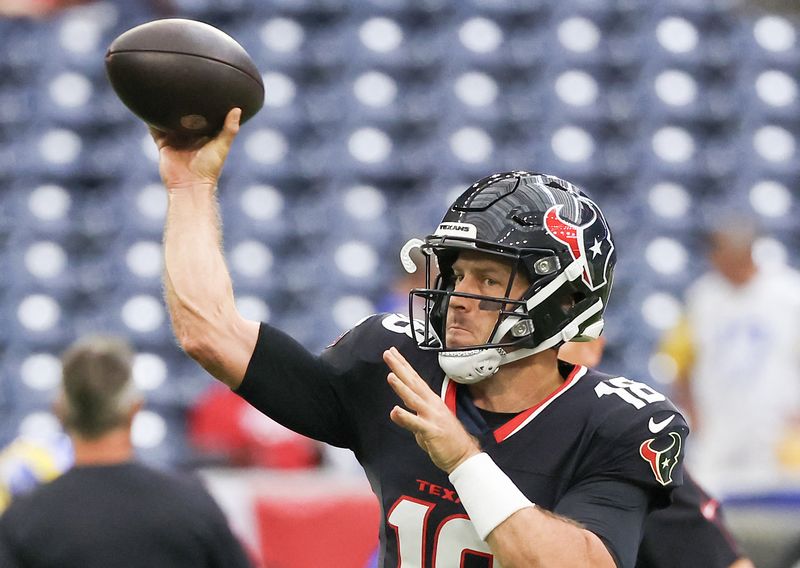 FILE PHOTO: Aug 24, 2024; Houston, Texas, USA;  Houston Texans quarterback Case Keenum (18) warms up before playing  against the Los Angeles Rams at NRG Stadium. Mandatory Credit: Thomas Shea-USA TODAY Sports/File Photo