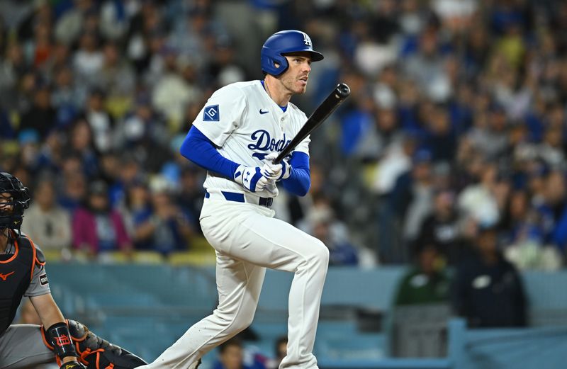 FILE PHOTO: Mar 29, 2025; Los Angeles, California, USA; Los Angeles Dodgers first baseman Freddie Freeman (5) hits a double in the seventh inning against the Detroit Tigers at Dodger Stadium. Mandatory Credit: Jonathan Hui-Imagn Images/File Photo