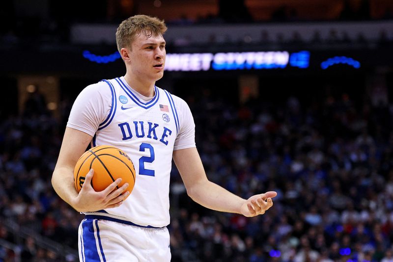 FILE PHOTO: Mar 27, 2025; Newark, NJ, USA; Duke Blue Devils forward Cooper Flagg (2) reacts after a play during the first half against the Arizona Wildcats during an East Regional semifinal of the 2025 NCAA tournament at Prudential Center. Mandatory Credit: Vincent Carchietta-Imagn Images/File Photo