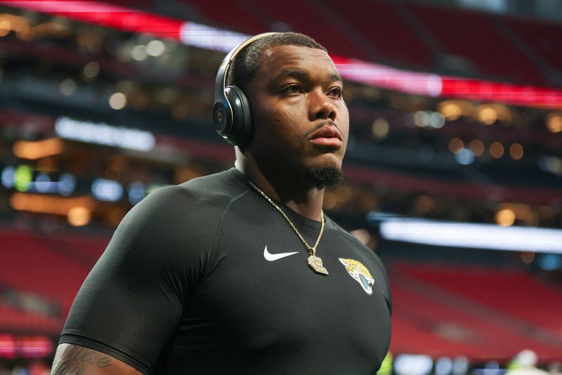 FILE PHOTO: Aug 23, 2024; Atlanta, Georgia, USA; Jacksonville Jaguars defensive end Travon Walker (44) prepares for a game against the Atlanta Falcons at Mercedes-Benz Stadium. Mandatory Credit: Brett Davis-USA TODAY Sports/File Photo