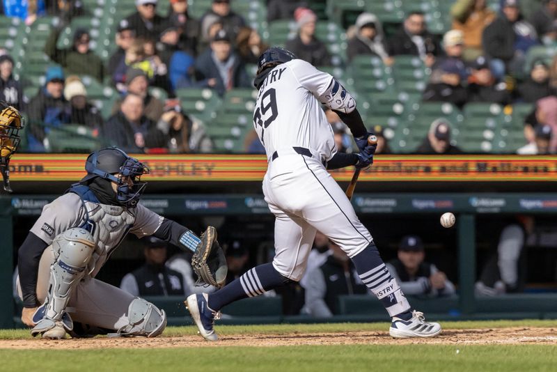 Apr 7, 2025; Detroit, Michigan, USA; Detroit Tigers shortstop Zach McKinstry (39) singles to left in the eighth inning against the New York Yankees at Comerica Park. Mandatory Credit: David Reginek-Imagn Images