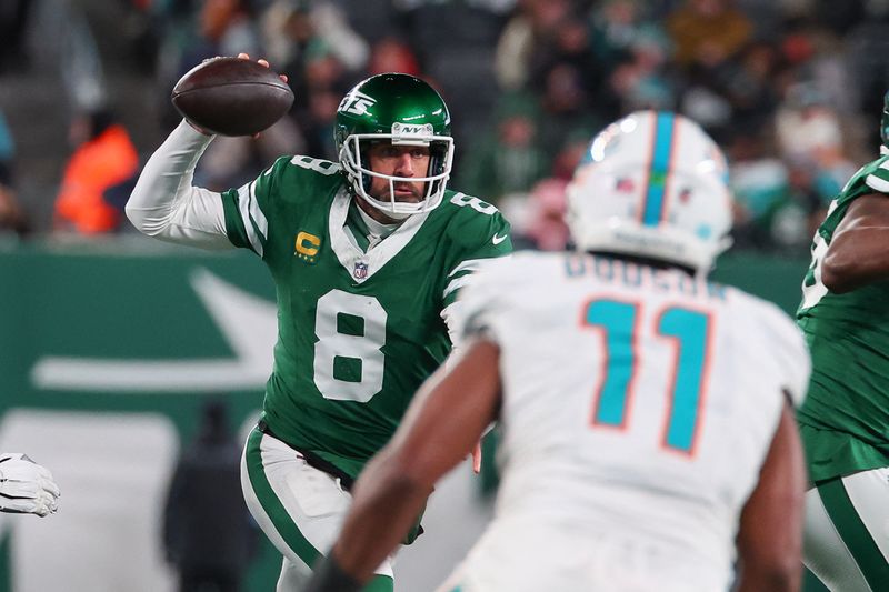 FILE PHOTO: Jan 5, 2025; East Rutherford, New Jersey, USA; New York Jets quarterback Aaron Rodgers (8) looks to pass during the third quarter of their game against the Miami Dolphins at MetLife Stadium. Mandatory Credit: Ed Mulholland-Imagn Images/File Photo