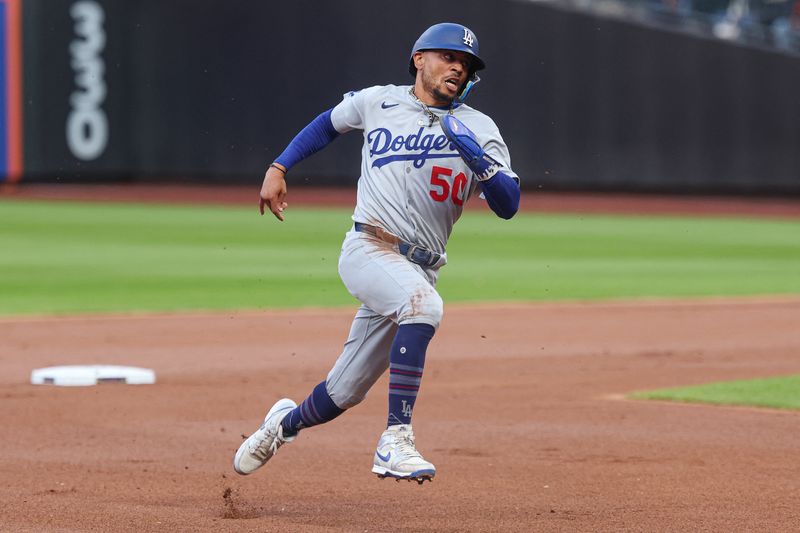 FILE PHOTO: May 25, 2025; New York City, New York, USA;Los Angeles Dodgers shortstop Mookie Betts (50) rounds the bases during a double by first baseman Freddie Freeman (np)   during the first inning against the New York Mets at Citi Field. Mandatory Credit: Vincent Carchietta-Imagn Images/File photo