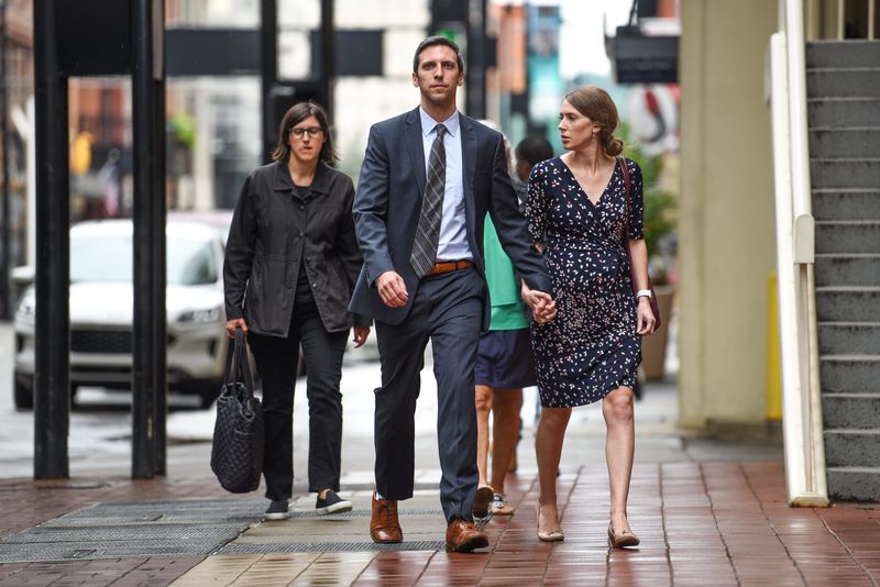 Former Cincinnati City Councilman P.G. Sittenfeld walks into court alongside his wife, Dr. Sarah Coyne, on Friday July 8, 2022, as a verdict in his public corruption was reached. He was found guilty on two of six counts.