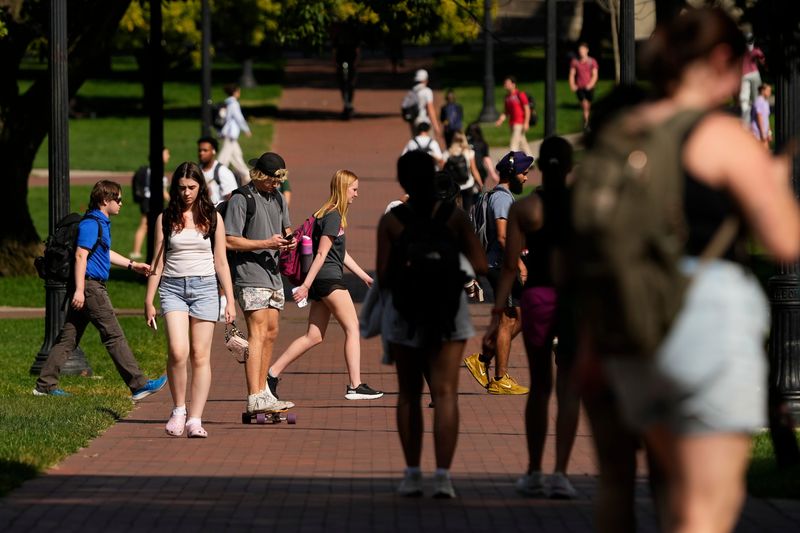 Students walk across the Oval on campus at Ohio State University in September 2024. Ohio State trustees approved a resolution allowing President Ted Carter to increase tuition and fees for undergraduate students once the Ohio biennial budget is finalized this summer.