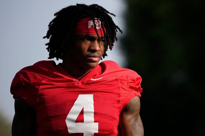 Ohio State Buckeyes wide receiver Jeremiah Smith (4) walks to practice for the Rose Bowl at Dignity Health Sports Park in Carson, Calif. on Dec. 30, 2024.