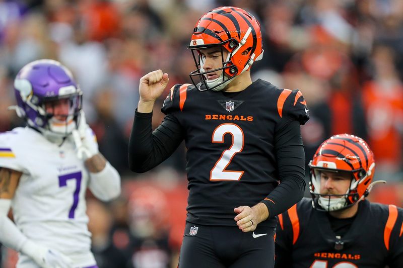 Dec 16, 2023; Cincinnati, Ohio, USA; Cincinnati Bengals place kicker Evan McPherson (2) reacts after the victory over the Minnesota Vikings in overtime at Paycor Stadium. Mandatory Credit: Katie Stratman-USA TODAY Sports
