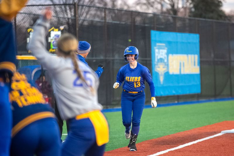 Teammates wait for Clyde's Taitum Jeffrey after Jeffrey's solo home run.