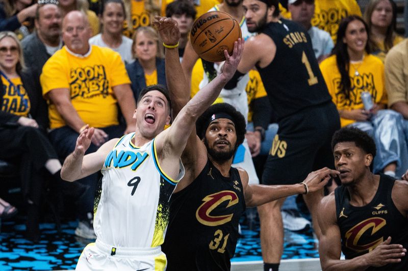 Indiana Pacers guard T.J. McConnell (9) shoots the ball while Cleveland Cavaliers center Jarrett Allen (31) defends during Game 3 of a second-round playoff series May 9, 2025, in Indianapolis, Indiana.