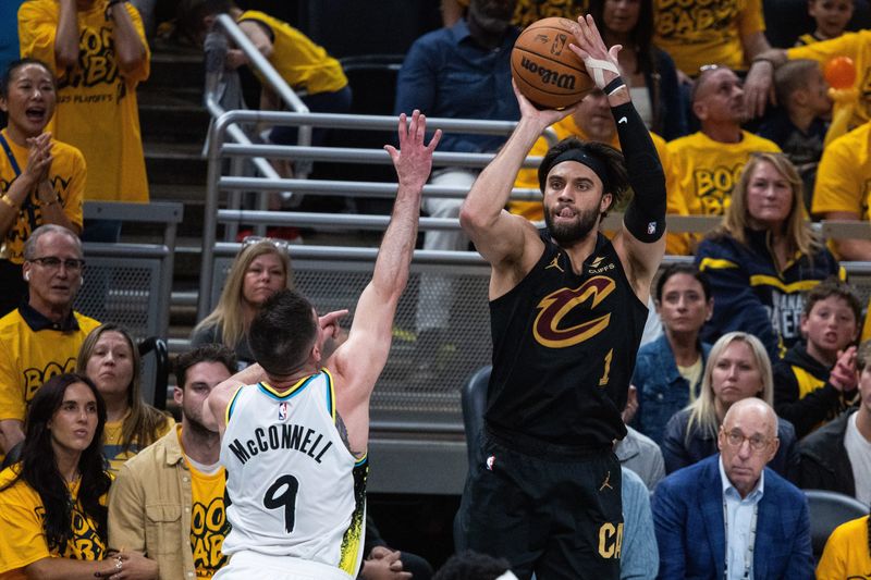Cleveland Cavaliers guard Max Strus (1) shoots the ball while Indiana Pacers guard T.J. McConnell (9) defends during Game 3 of a second-round playoff series May 9, 2025, in Indianapolis, Indiana.