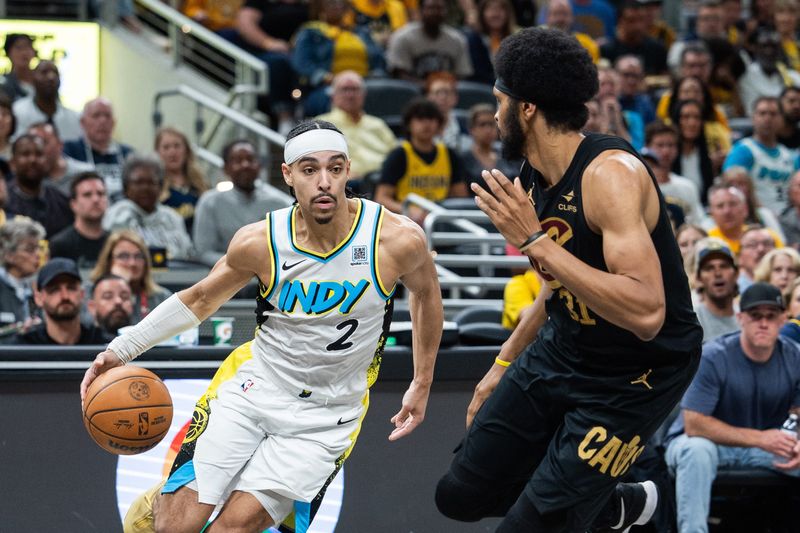 Indiana Pacers guard Andrew Nembhard (2) dribbles the ball as Cleveland Cavaliers center Jarrett Allen (31) defends during Game 4 of a second-round playoff series May 11, 2025, on Indianapolis, Indiana.