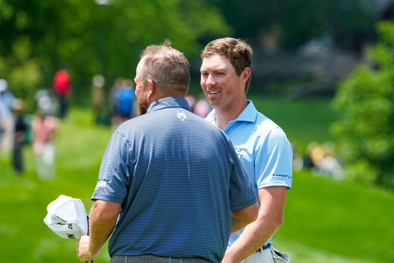 Ben Griffin speaks to Shane Lowry after Griffin made his putt on the 18th hole in the first round of the PGA’s Memorial Tournament at Muirfield Village Golf Club on Thursday, May 29, 2025 in Dublin, Ohio.