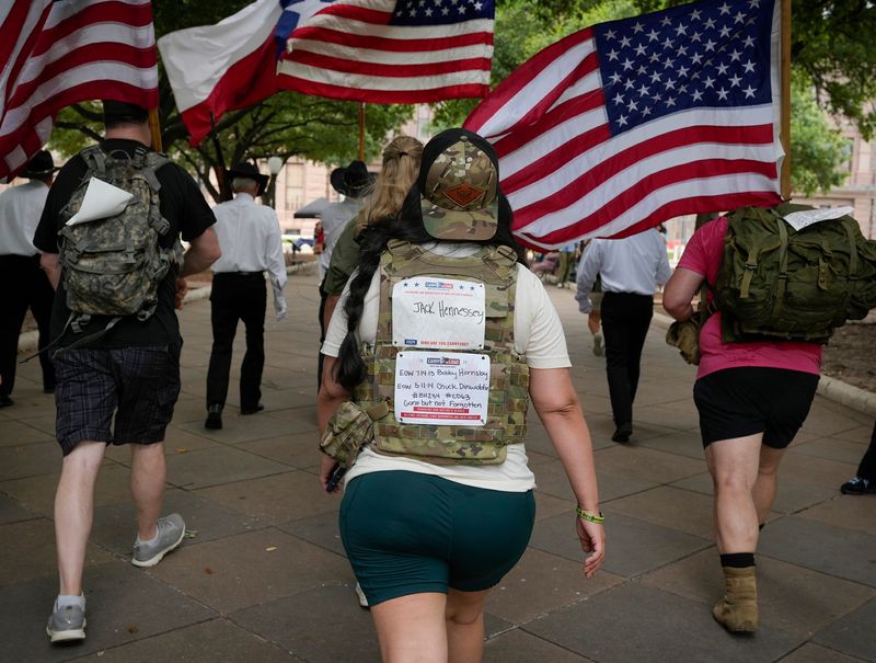Army National Guard Maj. Teresa Wilt, of Belton, walks up to the Capitol South Steps during the Carry the Load march from Zilker Park to the Capitol Tuesday May 21, 2024. Participants walked three miles to honor fallen military service members and first responders. Carry The Load is a non-profit organization founded in 2011 to restore the true meaning of Memorial Day.