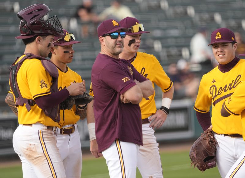 Arizona State manager Willie Bloomquist makes a pitching change during the seventh inning against Ohio State at Phoenix Municipal Stadium on Feb. 16, 2025.