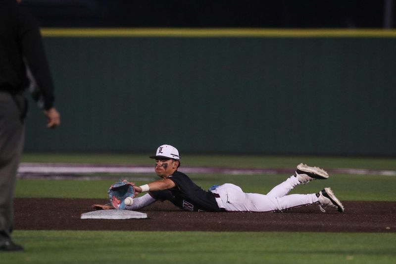 London's RJ Olivares attempts to stop a ground ball in the infield during Friday's game on March 14, 2025, in Corpus Christi, Texas.