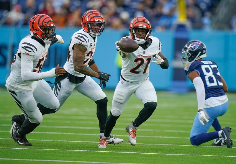 Cincinnati Bengals cornerback Mike Hilton (21) pulls in an interception of a pass by Tennessee Titans quarterback Will Levis (8) during the second quarter at Nissan Stadium in Nashville, Tenn., Sunday, Dec. 15, 2024.