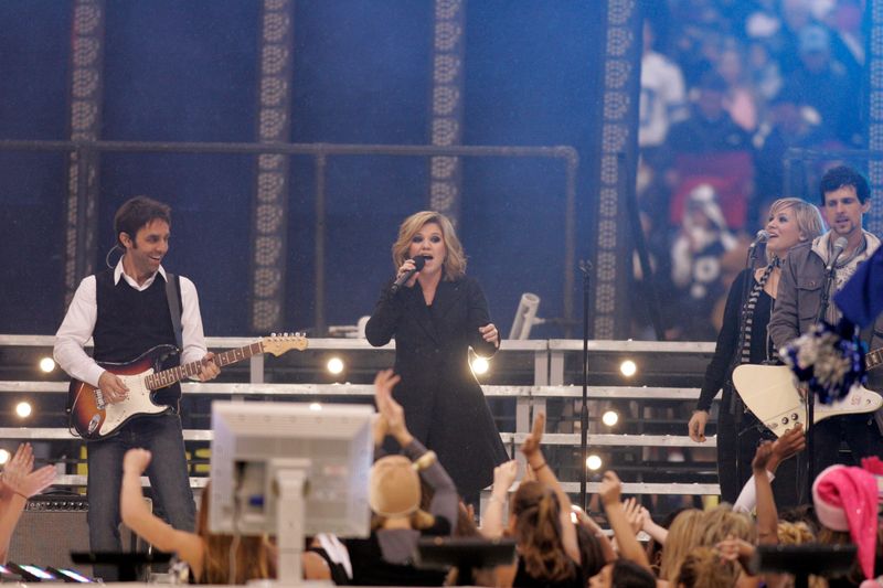 Nov 22, 2007; Dallas, TX, USA; Recording artist Kelly Clarkson performs at halftime in the Thanksgiving game between the Dallas Cowboys and the New York Jets at Texas Stadium. Mandatory Credit: Brett Davis-USA TODAY Sports