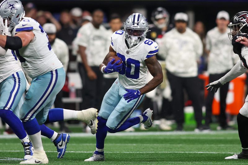 Nov 3, 2024; Atlanta, Georgia, USA; Dallas Cowboys wide receiver Ryan Flournoy (80) runs after a catch against the Atlanta Falcons in the fourth quarter at Mercedes-Benz Stadium. Mandatory Credit: Brett Davis-Imagn Images