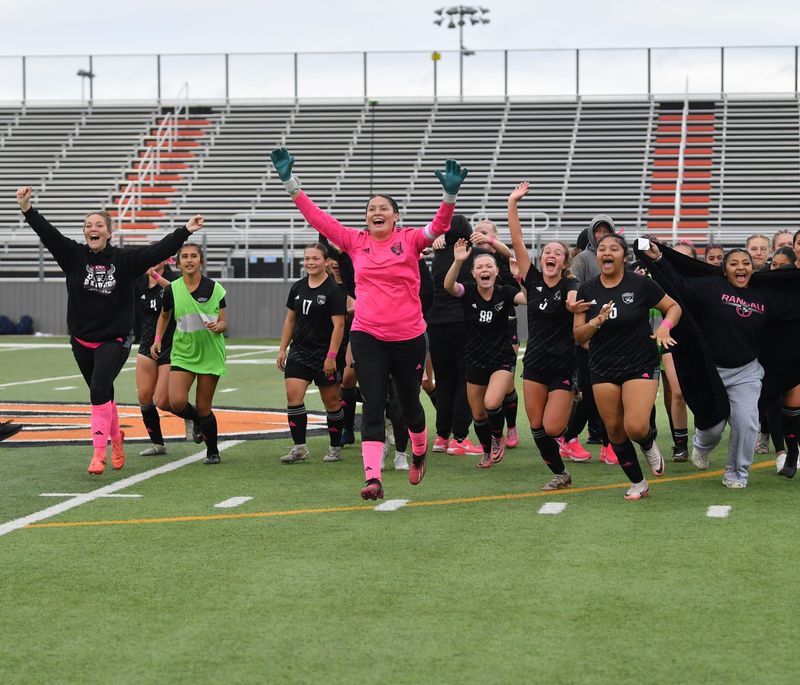 Randall players celebrate and run towards their fans after the state semi-final win against Aubrey on Friday, April 4, 2025 in Burkburnett.