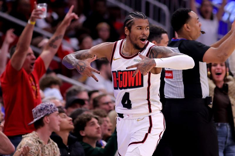 Apr 4, 2025; Houston, Texas, USA; Houston Rockets guard Jalen Green (4) reacts after a made basket against the Oklahoma City Thunder during the fourth quarter at Toyota Center. Mandatory Credit: Erik Williams-Imagn Images