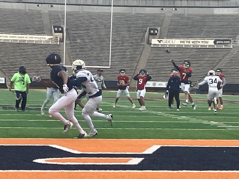 UTEP quarterback Malachi Nelson throws a pass in Saturday's scrimmage at the Sun Bowl. Jaime Guerrero (in white in the foreground) intercepted the pass.