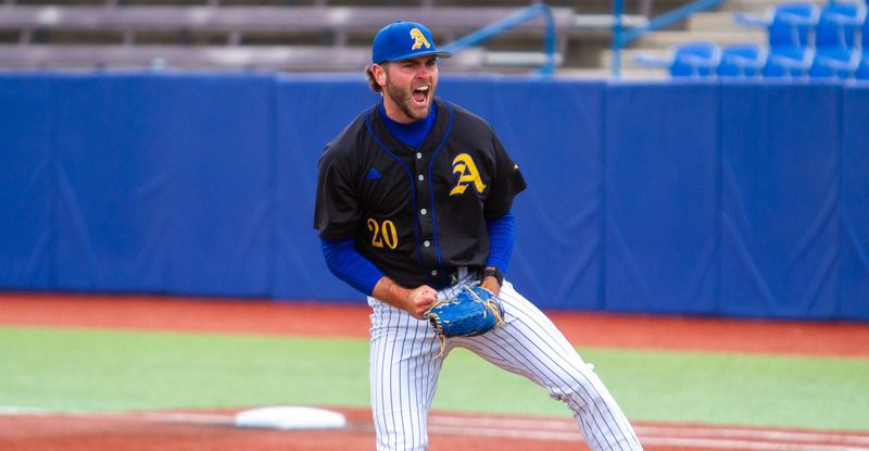 Angelo State baseball's Dax Dathe (20) celebrates after a strikeout for the final out in the sixth inning against St. Edwards at 1st Community Credit Union Stadium in San Angelo on Saturday, April 5.