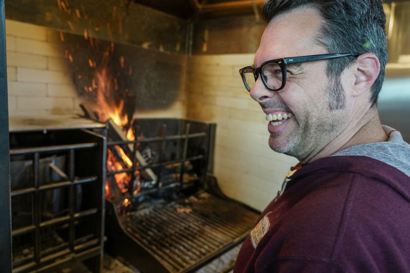 Aaron Franklin designed and welded the grill used at Uptown Sports Club.