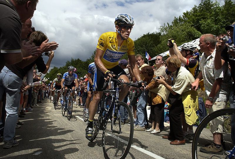 Austin celebrity cyclist and famed cancer survivor Lance Armstrong rides through rows of spectators during the Tour de France in 2005.