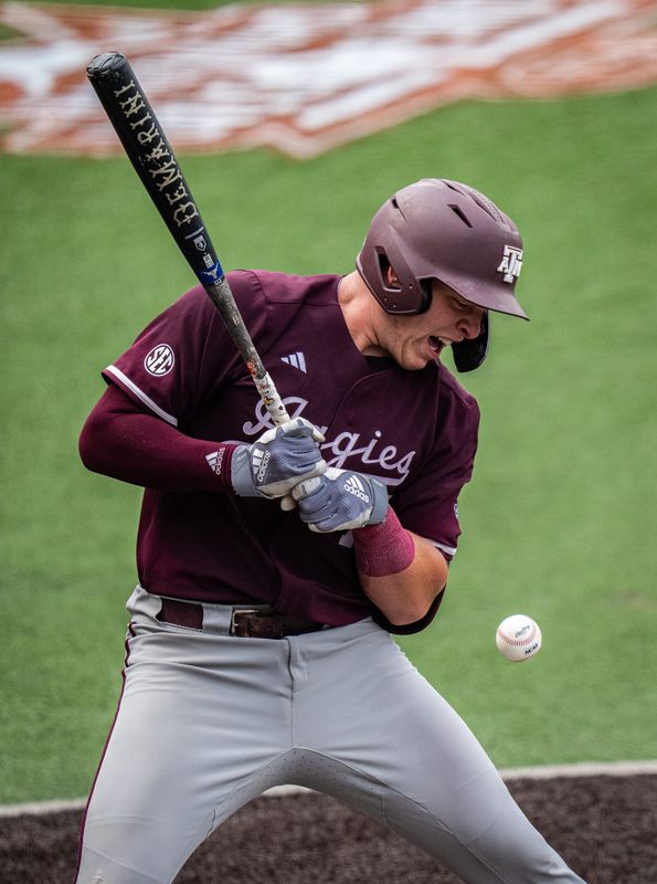 Texas A&M catcher Bear Harrison (16) is hit by a pitch in the fourth inning as the Longhorns play the Texas A&M Aggies in the second game of a three-game series on Saturday afternoon at UFCU Disch-Falk Field in Austin, April 26, 2025.