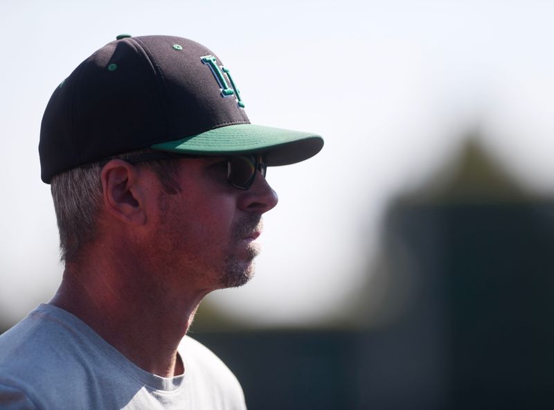 Iowa Park’s head softball coach Eric Simmons stands on the third baseline during the Region I-3A Division II state softball semifinals against Bushland, Saturday, May 10, 2025, at First United Park in Woodrow.