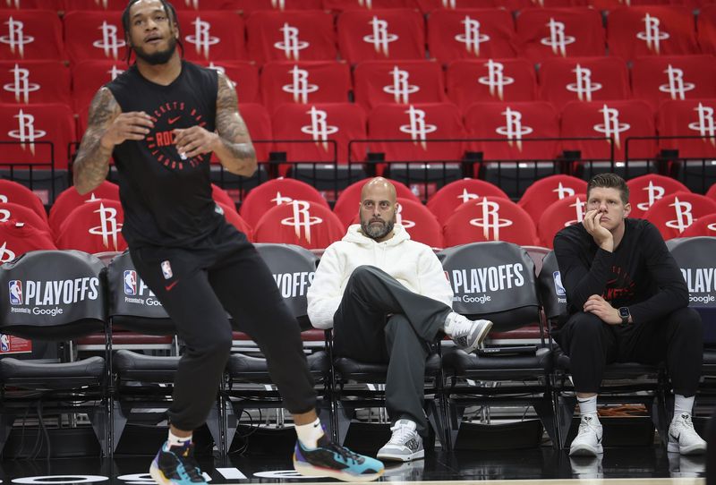May 4, 2025; Houston, Texas, USA; Houston Rockets general manager Rafael Stone (middle) watches during warmups before game seven of first round for the 2025 NBA Playoffs against the Golden State Warriors at Toyota Center. Mandatory Credit: Troy Taormina-Imagn Images
