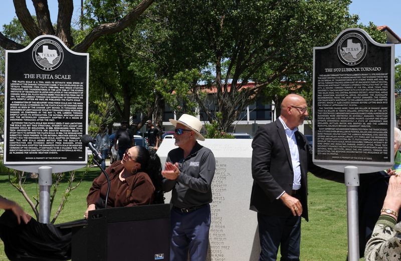 Attendees clap as the Texas Historical Markers of the 1970 Lubbock Tornado and the Fujita Scale are unveiled at a ceremony on May 11, 2025 in Lubbock, Texas. The ceremony was also on the 55th anniversary of the tornado that claimed 26 lives.