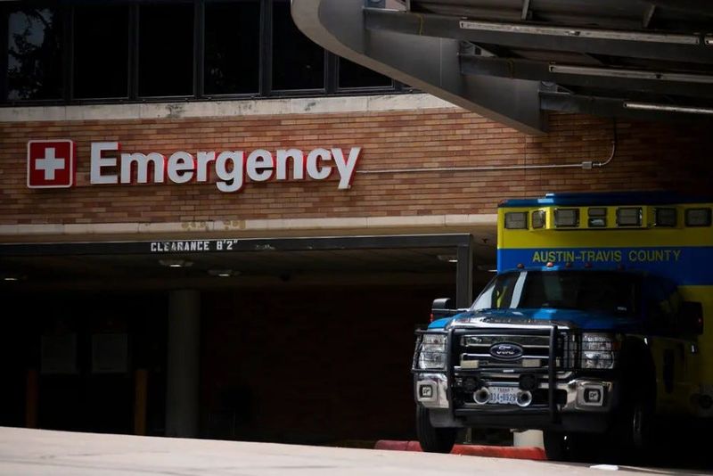 An Austin-Travis County EMS vehicle parked near a hospital's emergency entrance in Austin on July 7, 2020. Credit: Allie Goulding/The Texas Tribune