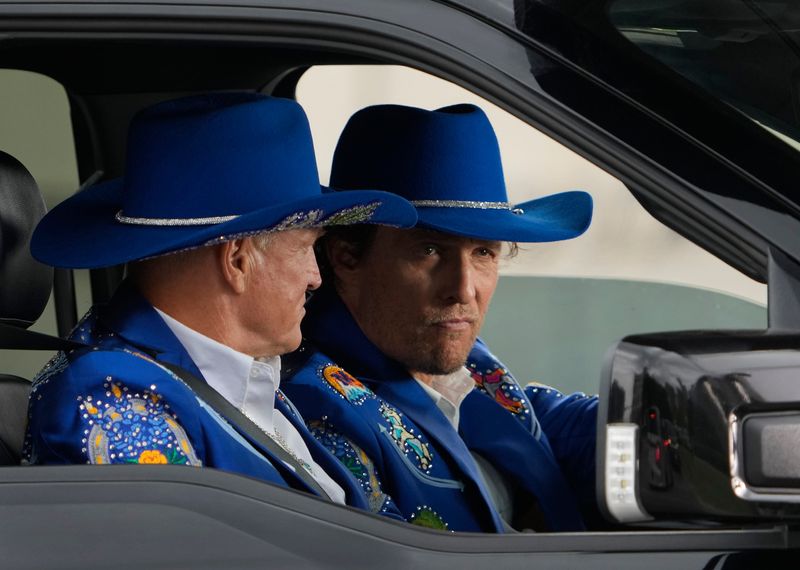 Woody Harrelson, left, and Matthew McConaughey film a scene for their upcoming Apple TV+ comedy series “Brothers.” The scene showed the two stars, who wore matching blue cowboy suits, riding in a Ford F-150 and being pulled over by Austin police officers on West Riverside Drive. The show's premise centers on the bond between McConaughey and Harrelson as they navigate life on McConaughey's Texas ranch.