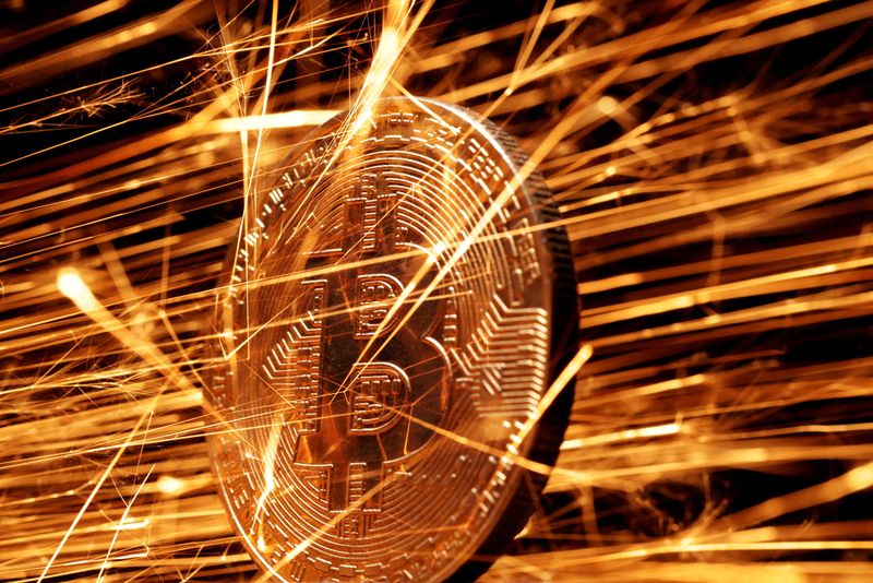 FILE PHOTO: FILE PHOTO: Illustration shows sparks strike representation of cryptocurrency Bitcoin