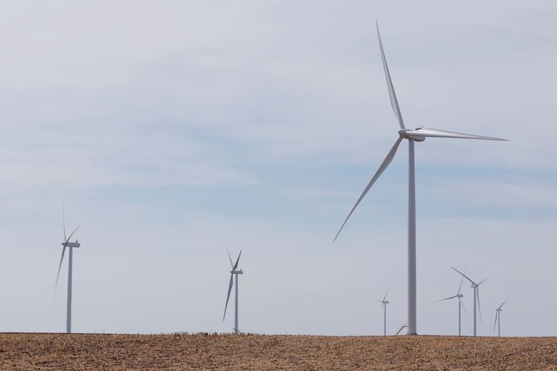 Wind turbines stand above the plains north of Amarillo, Texas
