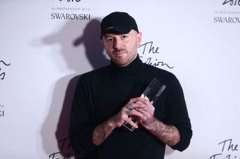 FILE PHOTO: Demna Gvasalia, winner of the International Urban Luxury Brand award poses for photographers at the Fashion Awards 2016 in London