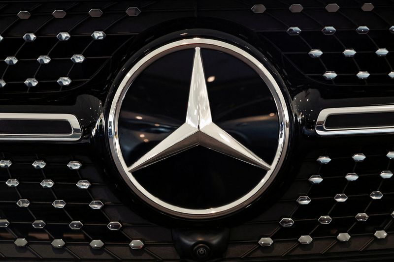 FILE PHOTO: A logo of Mercedes-Benz is seen inside a Mercedes-Benz car dealer in Arnhem