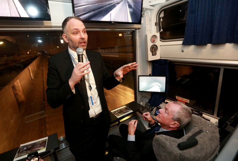 FILE PHOTO: Amtrak's Stephen Gardner (L) speaks to New Jersey Governor Phil Murphy (R) and members of a state Congressional delegation during a tour of the Gateway Project through the North River Tunnel beneath the Hudson River, in Weehawken, New Jersey, U.S., January, 28, 2019.   Ed Murray/N.J. Advance Media/Pool via REUTERS/File Photo
