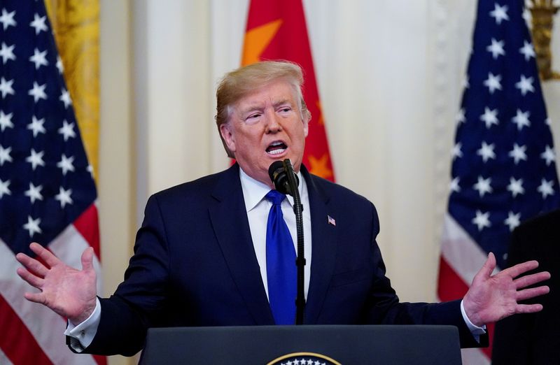 FILE PHOTO: U.S. President Donald Trump speaks prior to signing "phase one" of the U.S.-China trade agreement in the East Room of the White House in Washington, U.S., January 15, 2020. REUTERS/Kevin Lamarque/File Photo
