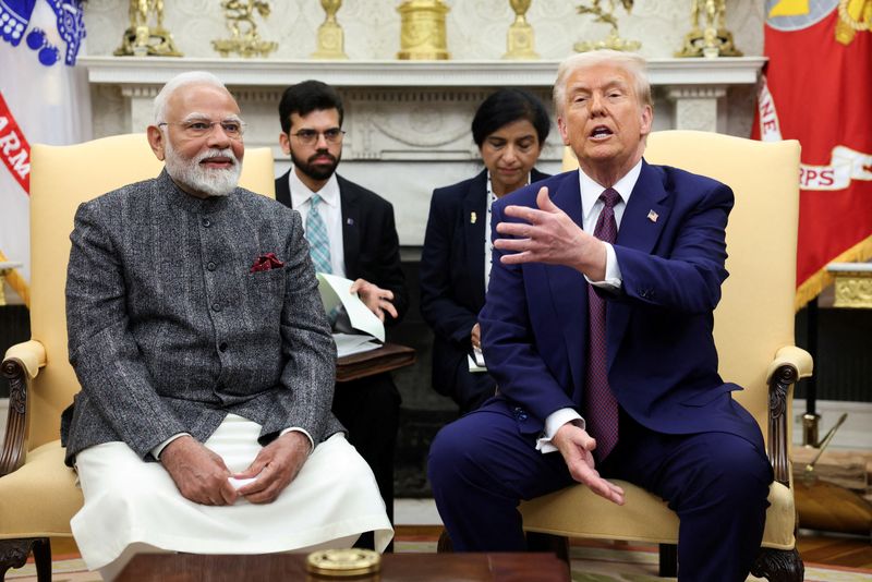 FILE PHOTO: U.S. President Donald Trump meets with Indian Prime Minister Narendra Modi at the White House in Washington, D.C., U.S., February 13, 2025. REUTERS/Kevin Lamarque/File Photo